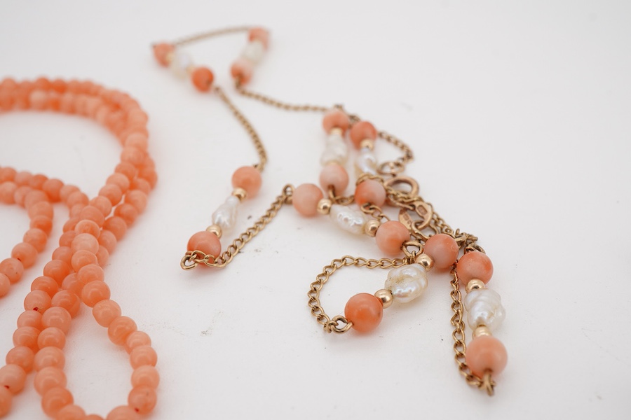 A suite of modern 9ct gold, coral and baroque pearl set jewellery, comprising a necklace, 38cm, a bracelet, 16cm and a pair of drop earrings, together with one other coral bead necklace.